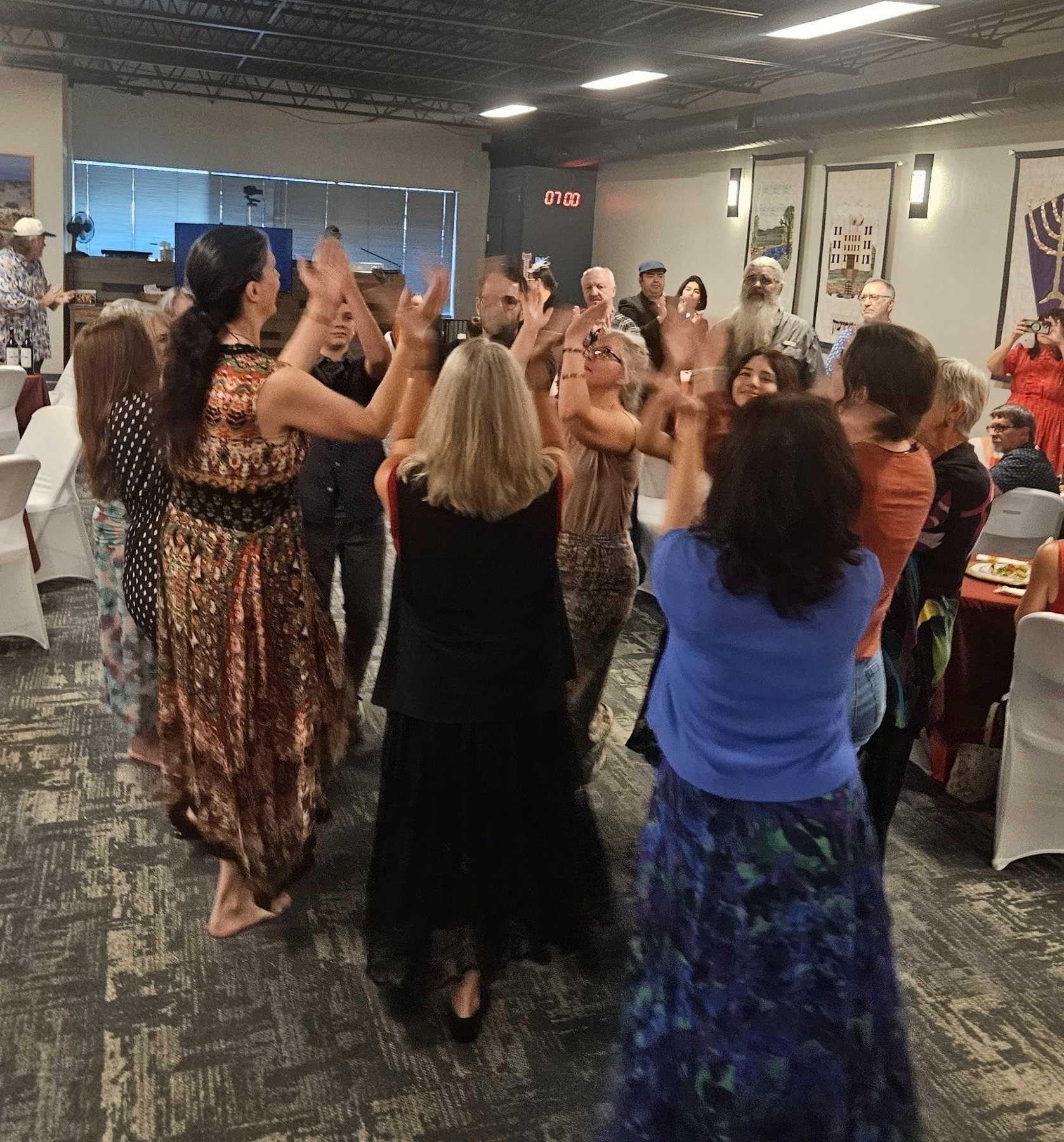 Congregation raising their hands together