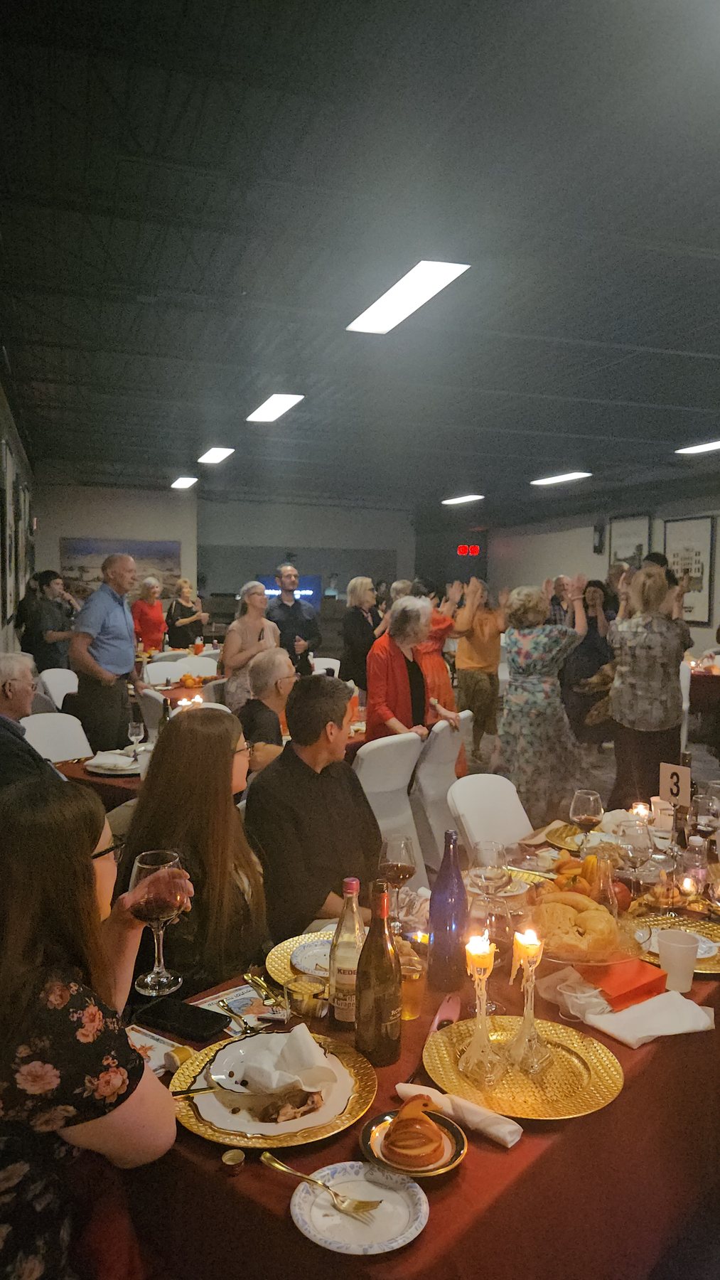Congregation worshipping around the tables