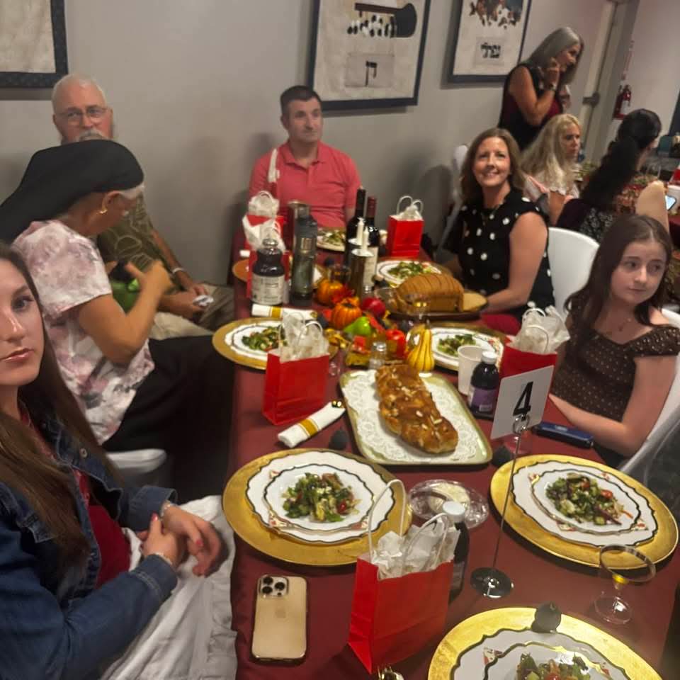 Guests enjoying fellowship at Bet Ami