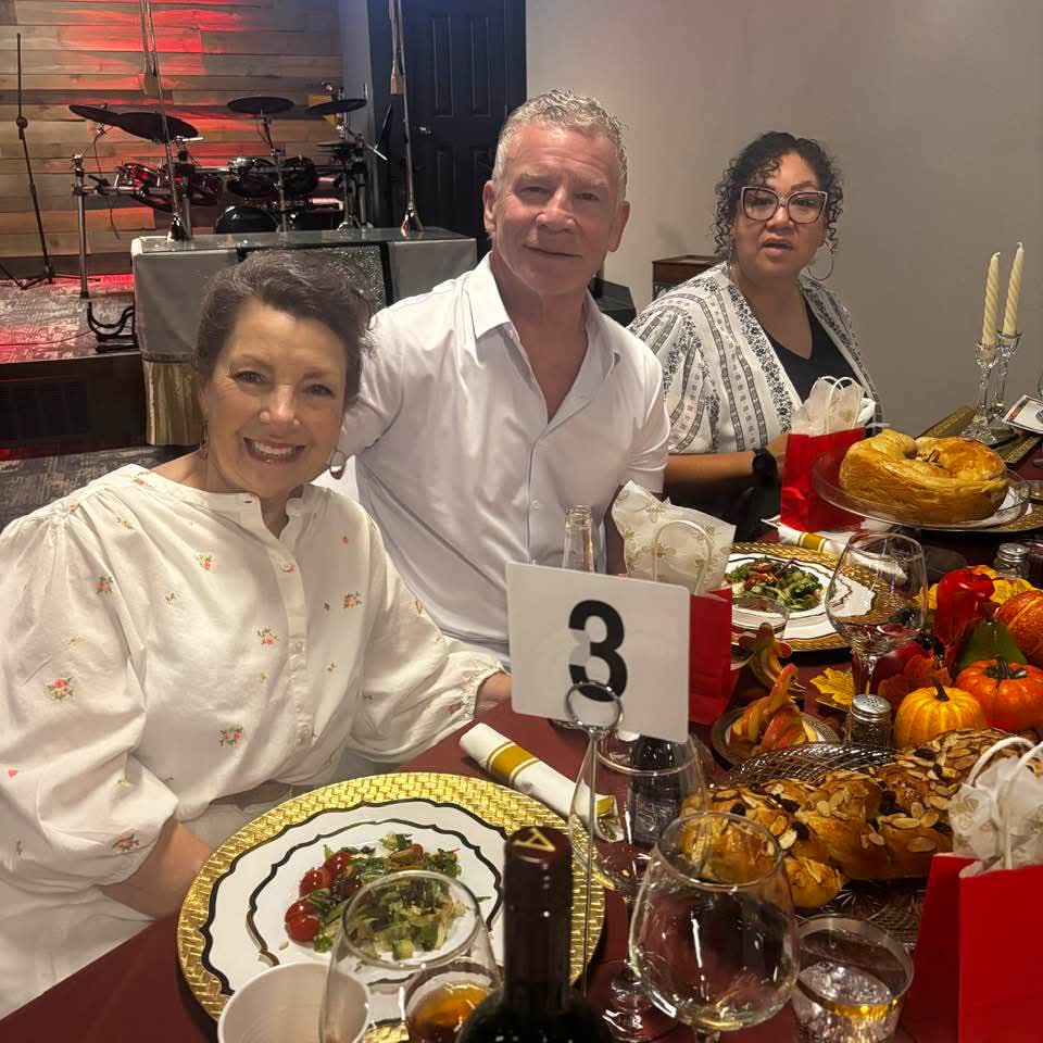 Three friends seated at table number three